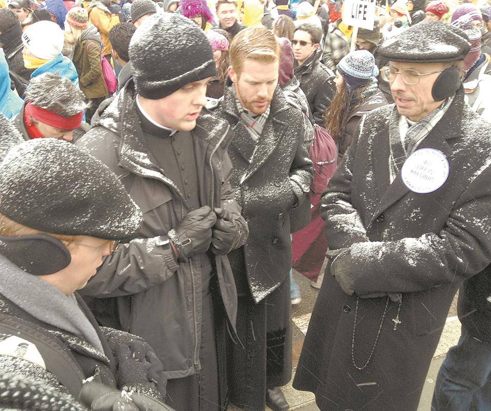 Bishop Peter Jugis praying with clergy and seminarians during a March for Life in D.C.