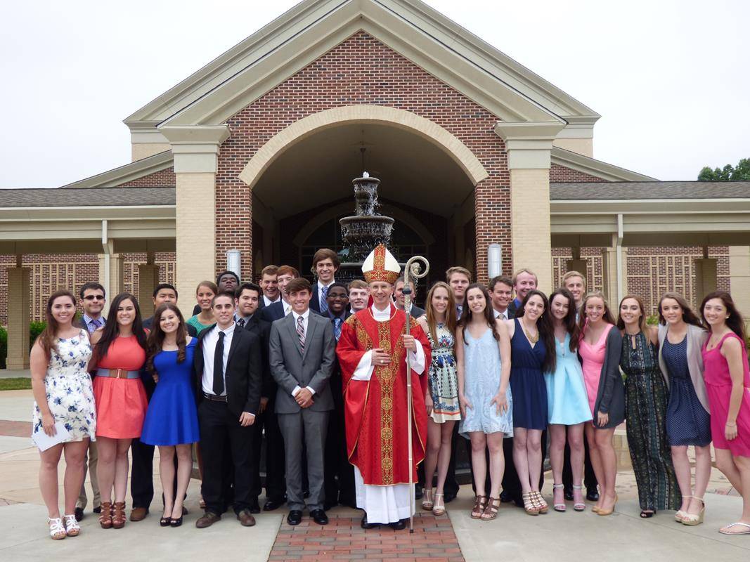 With Christ the King High School's inaugural graduating class after baccalaurate Mass at St Mark Church in 2015 