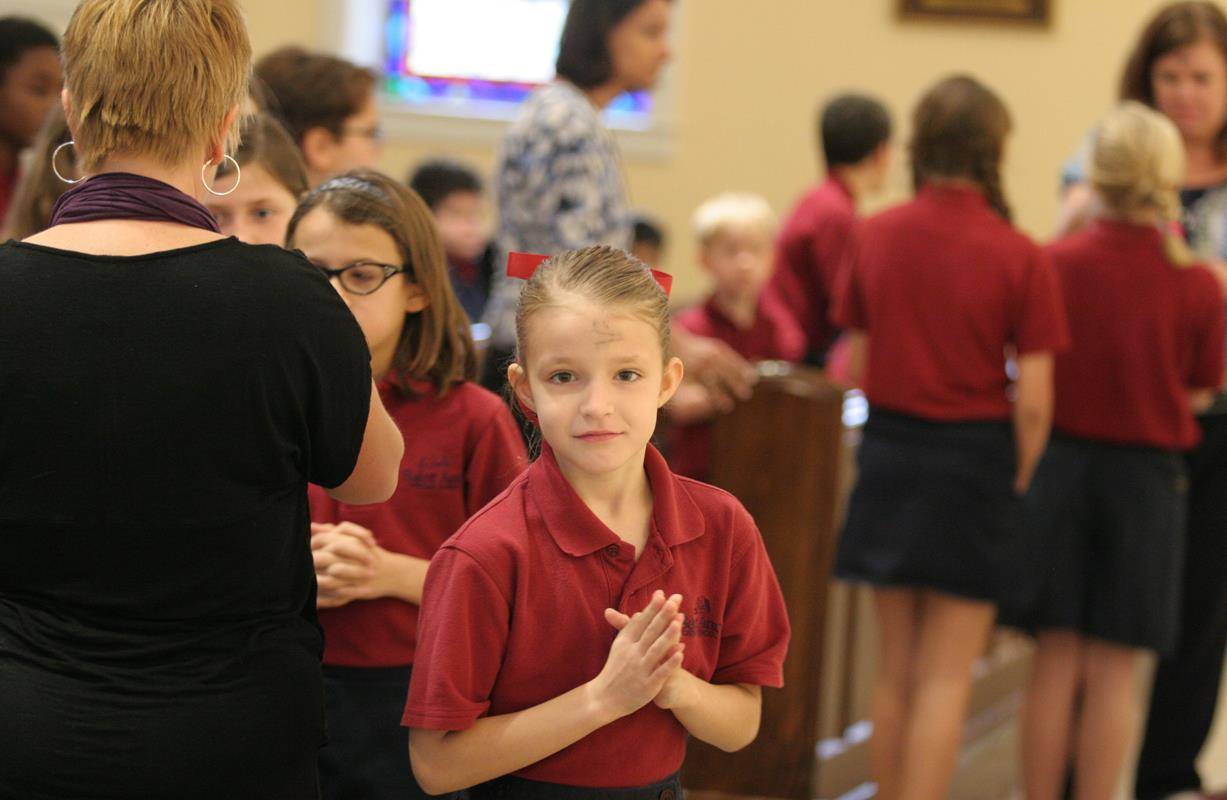 Students at St. Ann School receive ashes. 