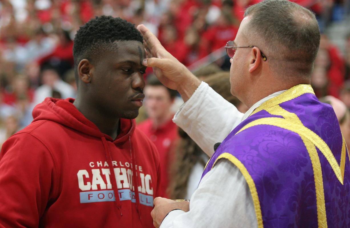 Students at Charlotte Catholic High School during Mass on Ash Wednesday