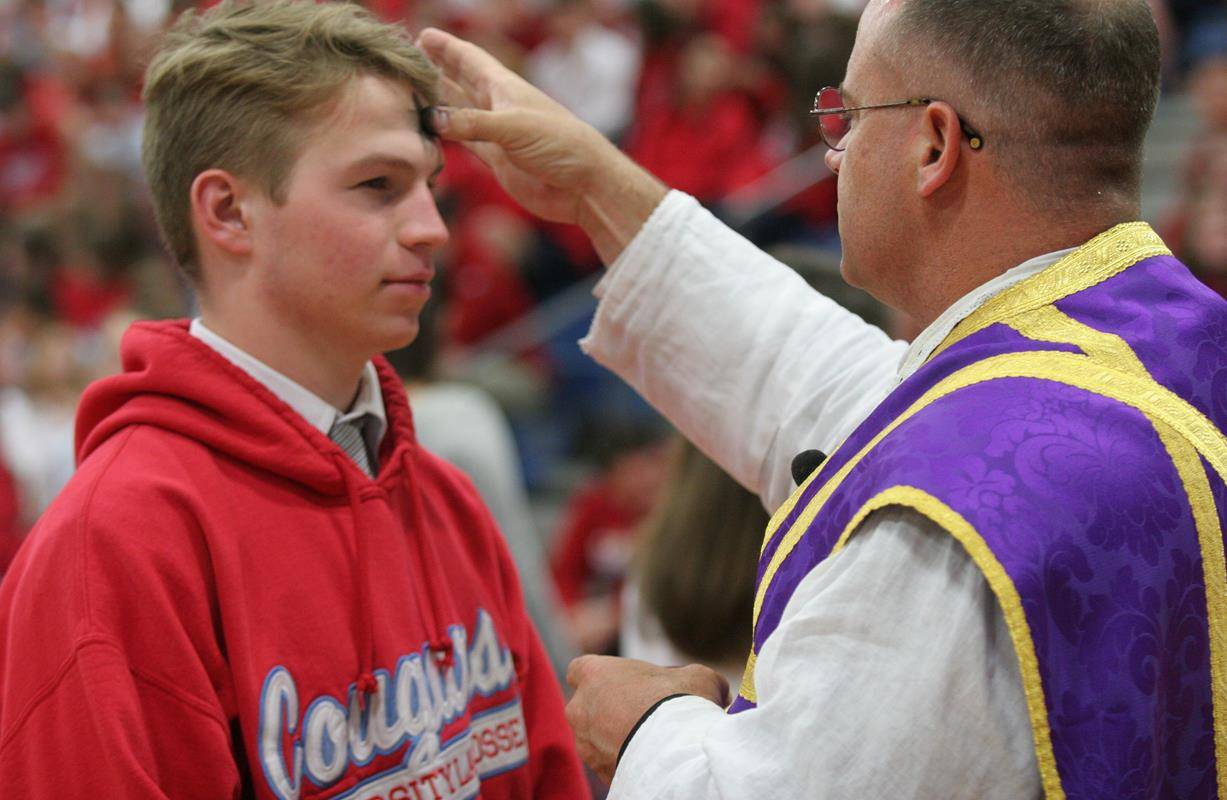 Students at Charlotte Catholic High School during Mass on Ash Wednesday