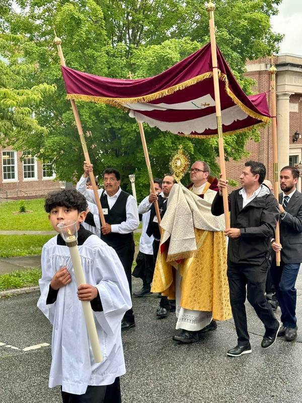 The Knights of Columbus and altar servers led a procession of the Blessed Sacrament carried by Father David from Immaculate Conception Church in Hendersonville. 