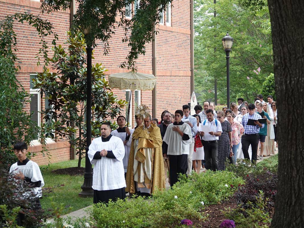 Bishop José Mauricio Vélez García, Auxiliary Bishop of Medellín, Colombia, celebrates Mass and leads a Eucharistic Procession around St. Mark Church in Huntersville.