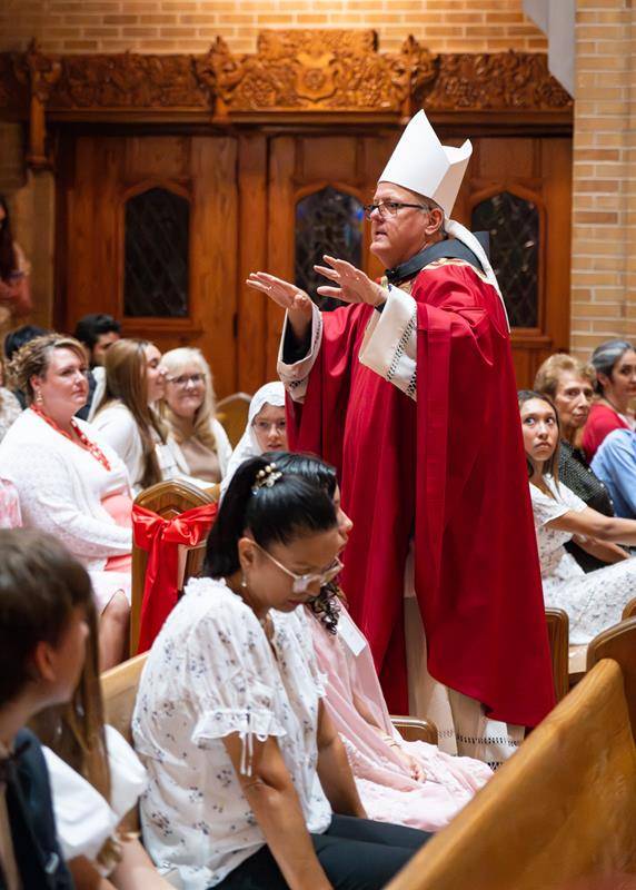 The new bishop engaged the candidates and the entire congregation during his homily.
