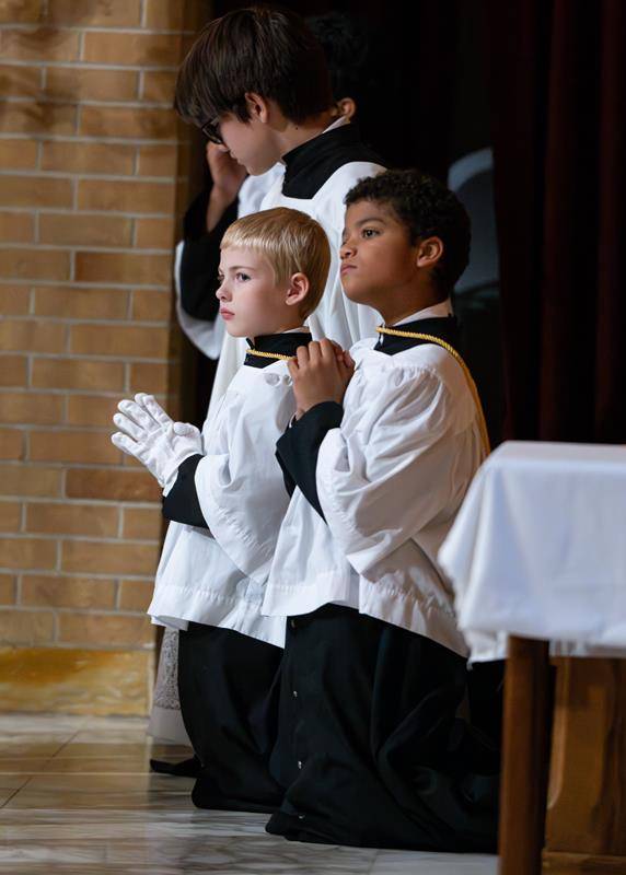 Even the youngest altar servers remained prayerful throughout the Mass.