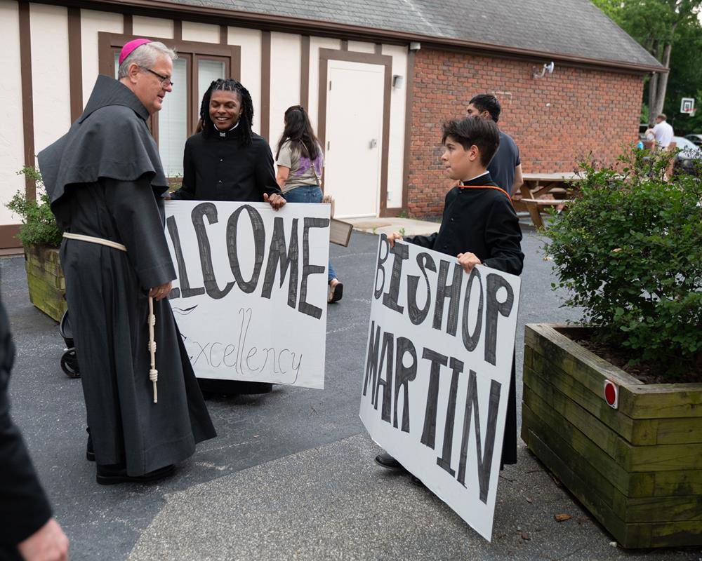 Bishop Martin greeted the young men upon his arrival.
