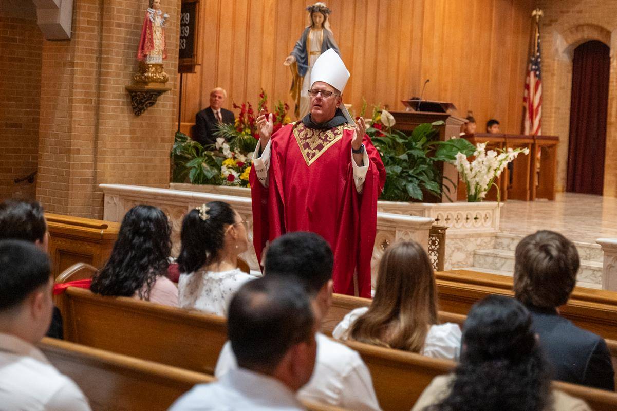 The new bishop urged the candidates not to be afraid to share Christ with the world and let others follow them to Jesus.