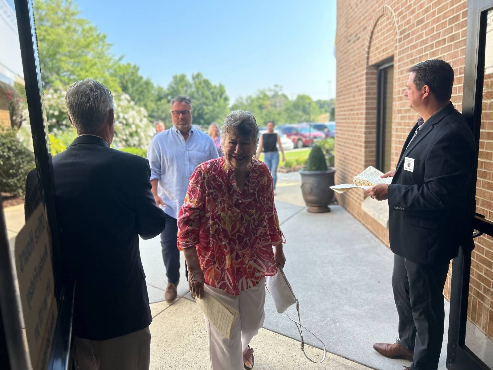 Ushers greet parishioners.