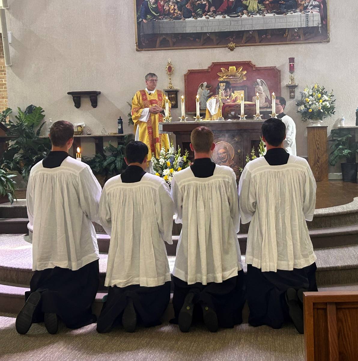 At the conclusion of Mass, Father Joseph Mack, pastor, noted the return of the tabernacle doors which have been adorned in gold leaf in honor of the anniversary with the help of a local Catholic artist, Erik Shea Saalmuller.