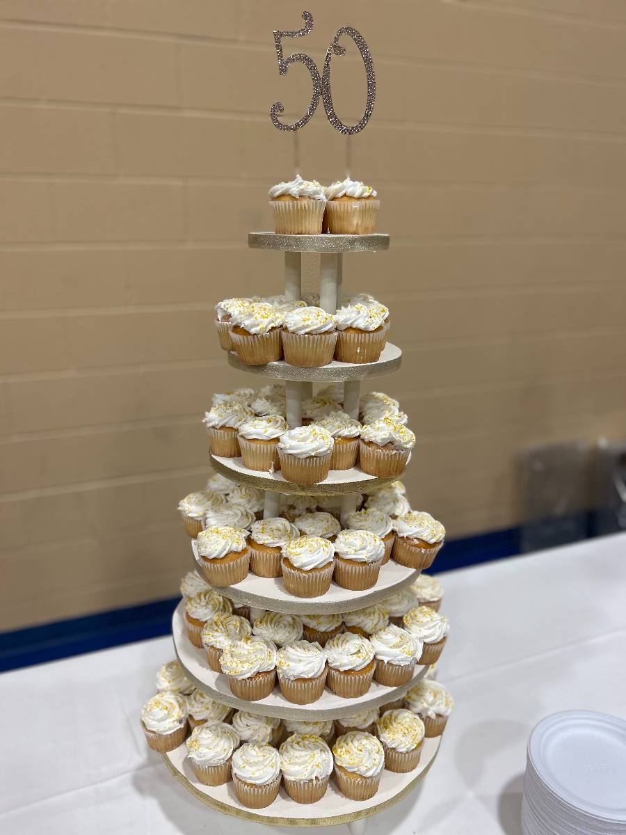 Young and old enjoyed cupcakes from four decorative towers.