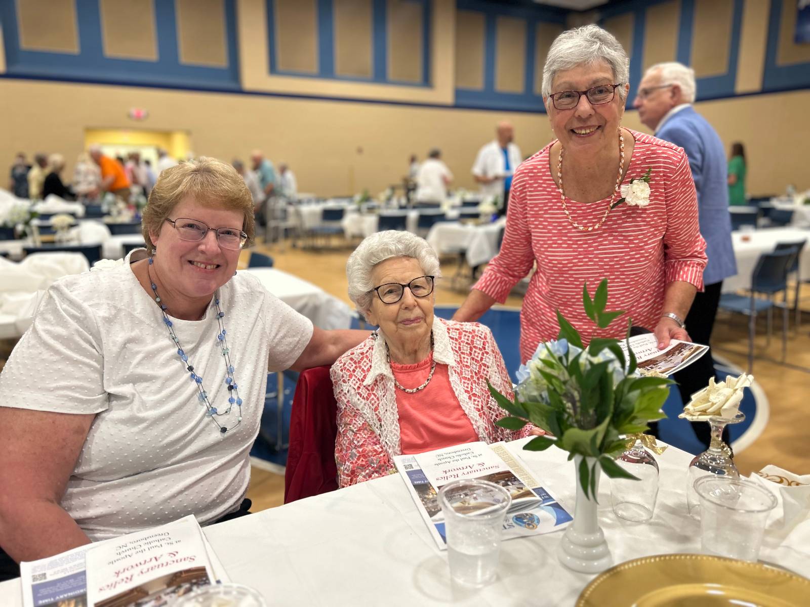 Longtime parishioners Linda Boehlein, Betty Klinc and Phyllis Regan enjoyed celebrating together. Klinc and Regan reminisced about their roles in the parish's production of 