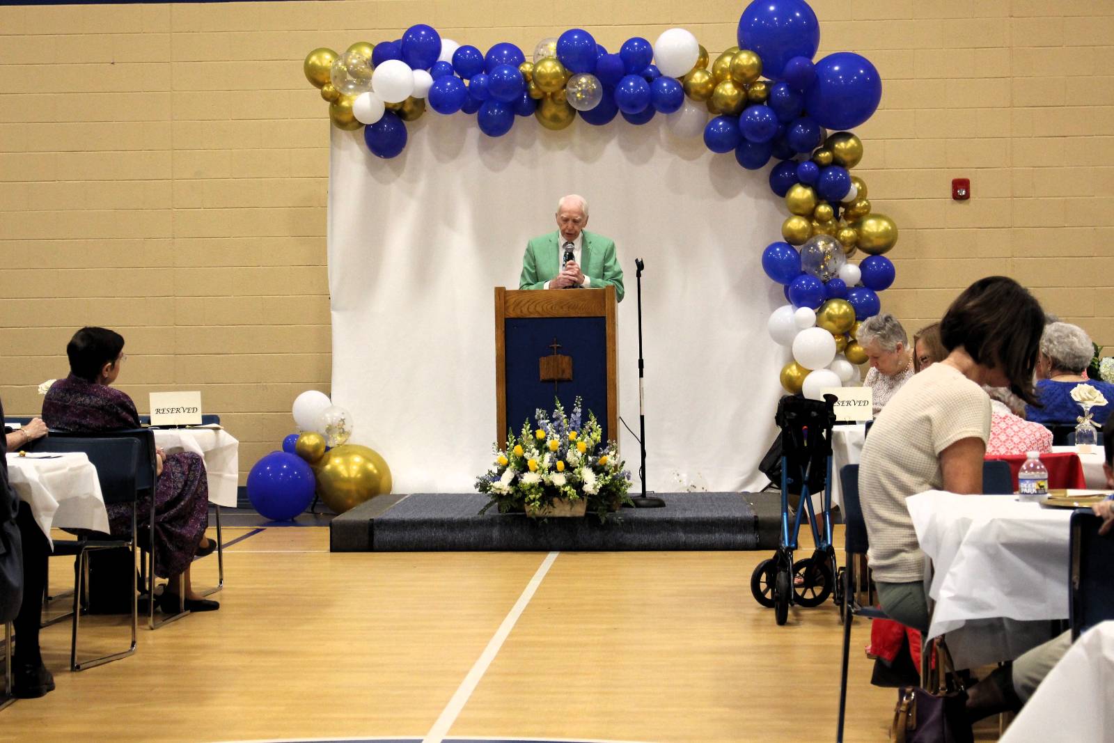 Deacon Larry Lisk offers a blessing before the meal.