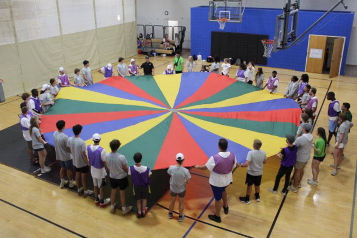 Campers enjoy a range of collaborative activities like this one hosted by RyzAb0ve Fitness. 