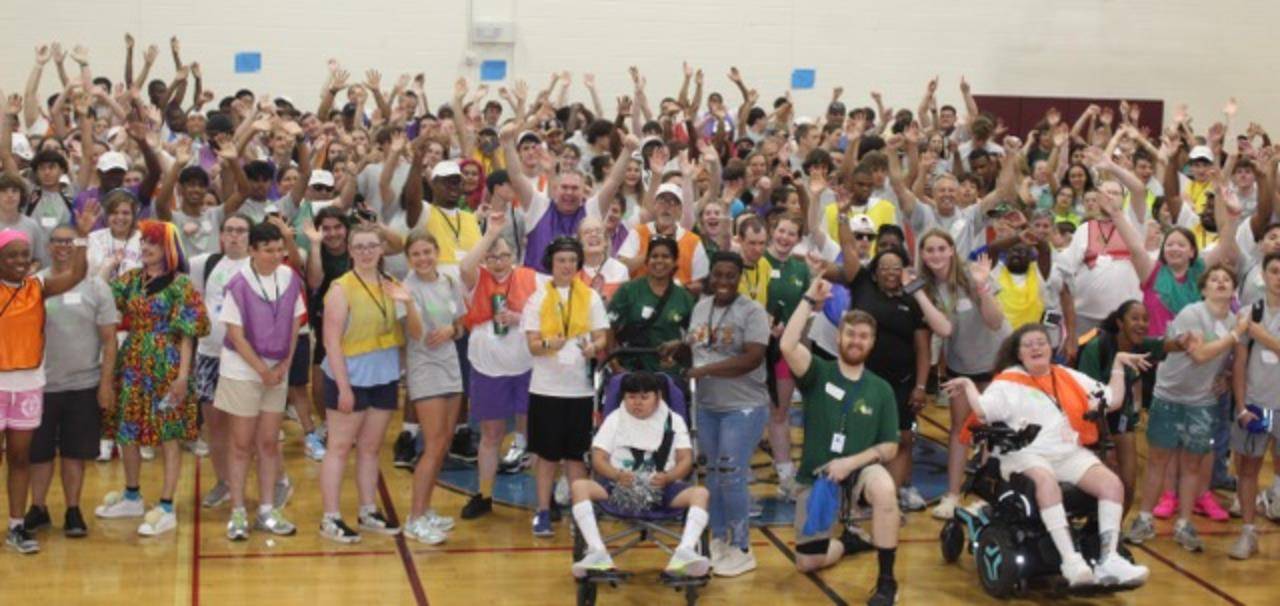 The entire company of Camp SOAR at the closing dance party in the JCC gym.