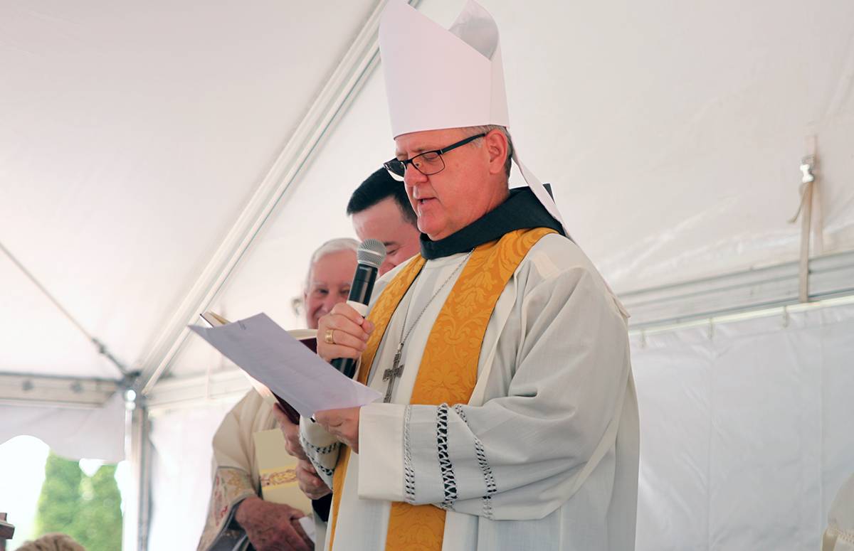 Bishop Martin read a formal decree announcig the commencement of work on the building of the church.
