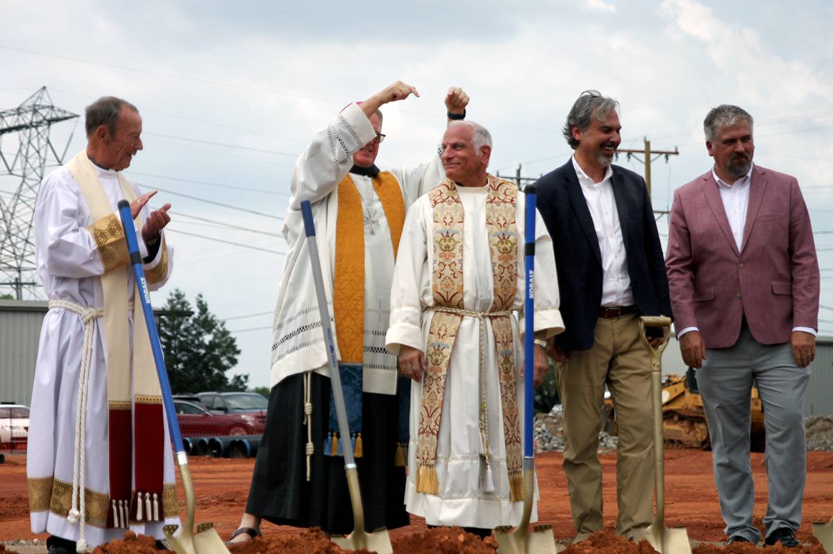 As the crowd cheered the groundbreaking, Bishop Martin pointed to Father Malacari, who earlier he had commended for his patience and commitment to the project, 10 years in the making.