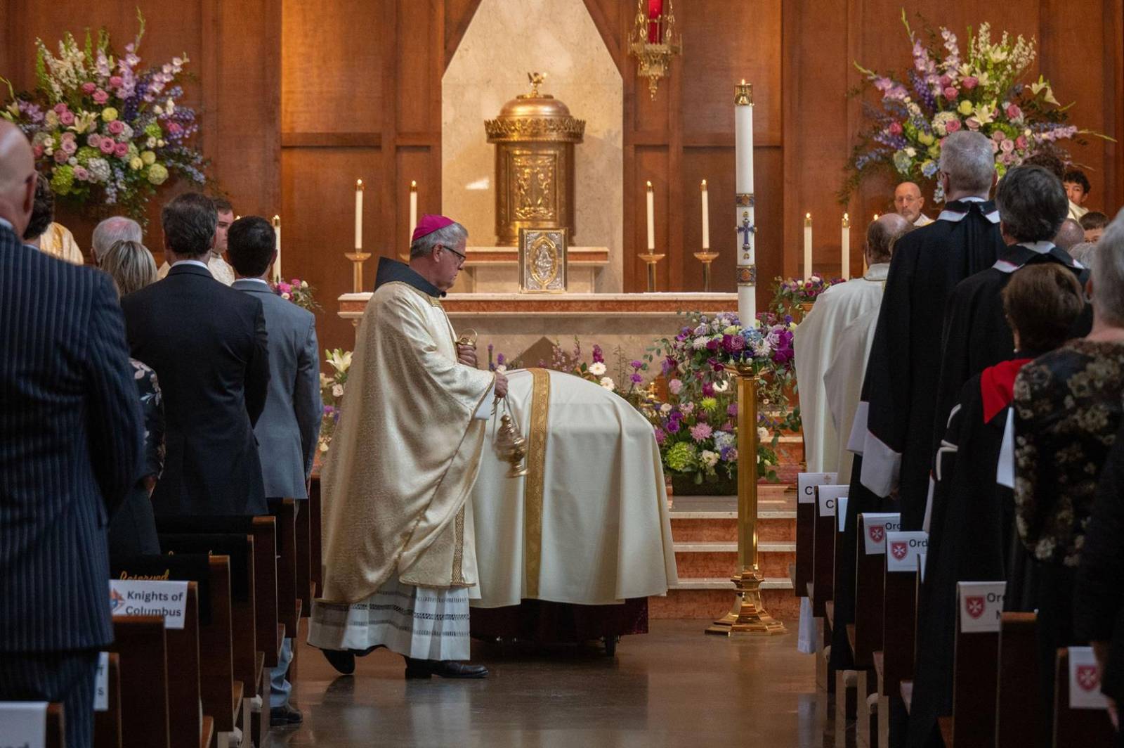Charlotte Bishop Michael Martin incenses the casket at the start of the funeral Mass.