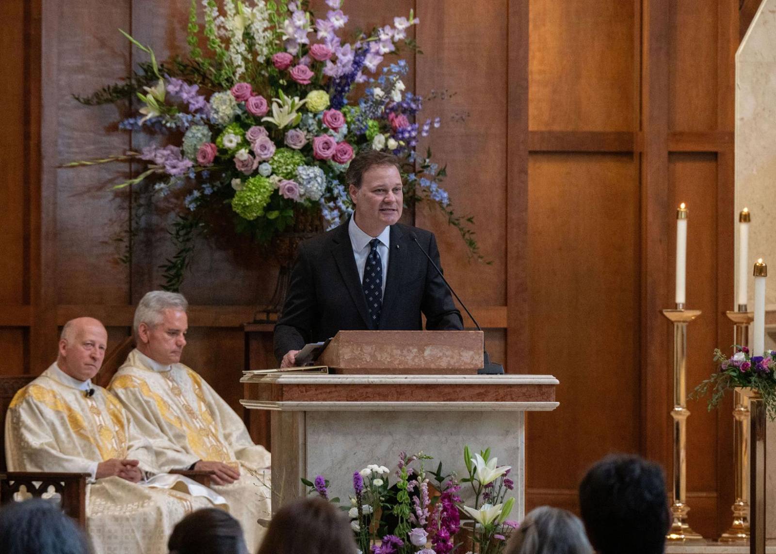 Parishioner and friend Derek Ritzel gives remarks at the end of the funeral Mass.