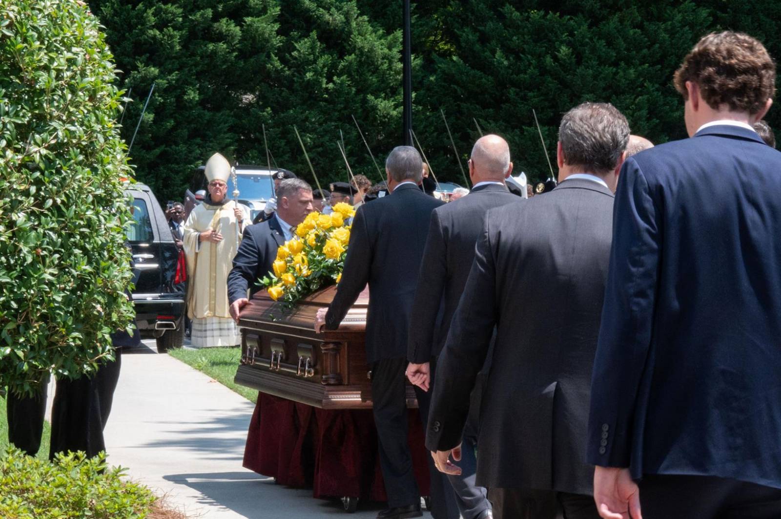 The casket is placed in the hearse after the final commendation and farewell.