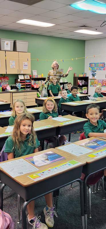 Students smile for the first day at St. Mark School in Huntersville.