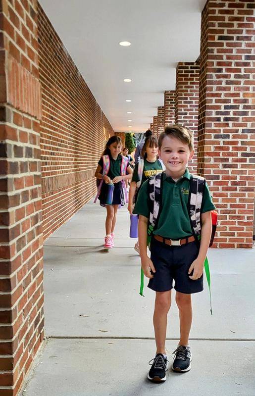 Students arrive for the first day at St. Mark School in Huntersville.