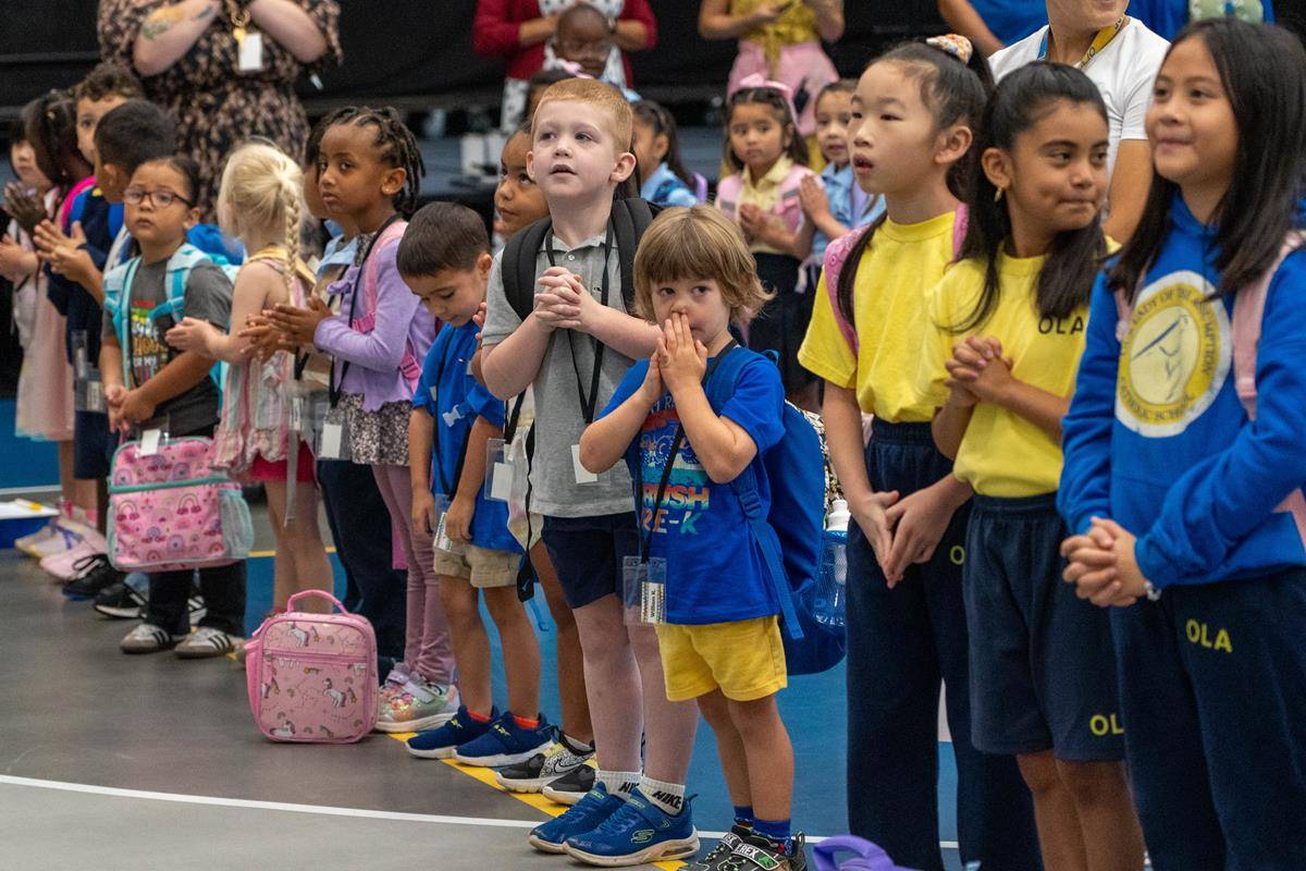 Students are excited to start classes on the first day of school at Our Lady of the Assumption School in Charlotte.
