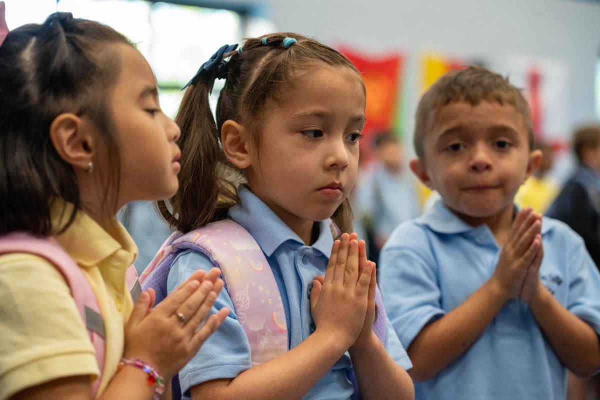 Students are excited to start classes on the first day of school at Our Lady of the Assumption School in Charlotte.