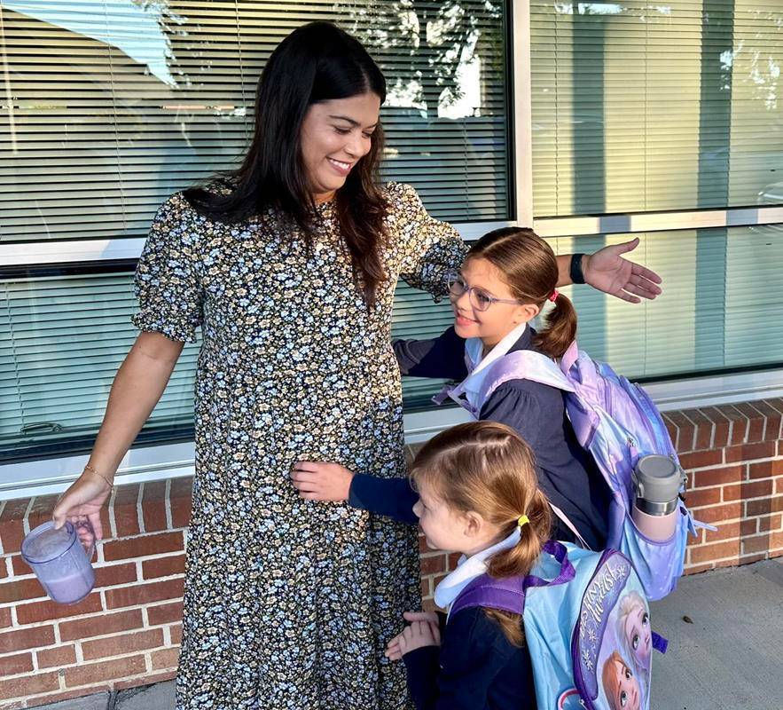 New students at Immaculata Catholic School had nothing but hugs for Principal Margaret Beale.