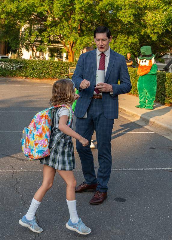 Dr. Greg Monroe, Superintendent of schools, visits with students at St. Patrick School in Charlotte on the first day of school. 