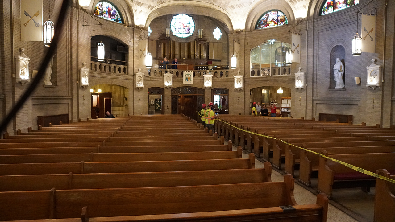 Technicians survey the interior of the basilica. 