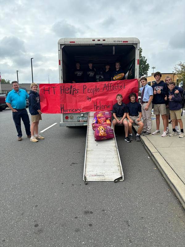 Holy Trinity Middle School students load water and supplies to be taken to western North Carolina.