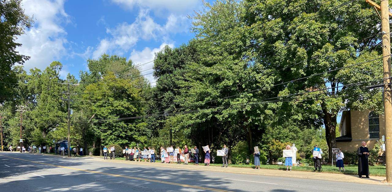 Supporters lined Park Road in Charlotte in front of St. Ann Church.