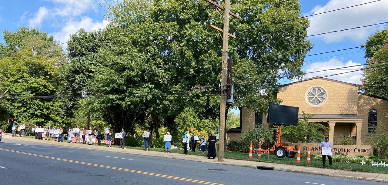 Supporters lined Park Road in Charlotte in front of St. Ann Church.