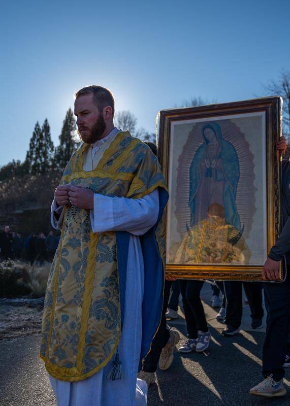 Father Aaron Huber led the procession, which featured an image of Our Lady of Guadalupe.