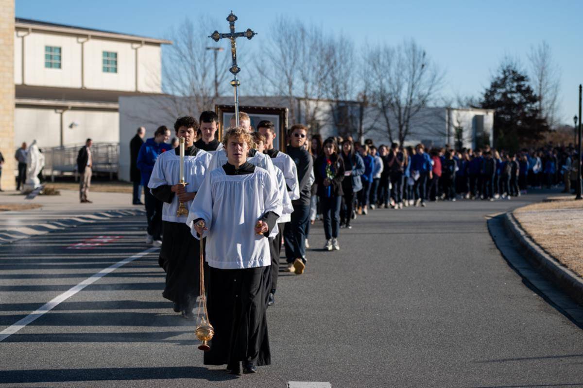 Christ the King High School students processed to the gym for Mass.