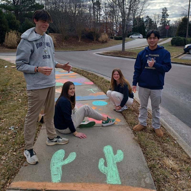 Bishop McGuinness High School student baked homemade cookies, cleaned around the house, chalked the walk, and made welcome cards for SECU Family House of Winston Salem. 