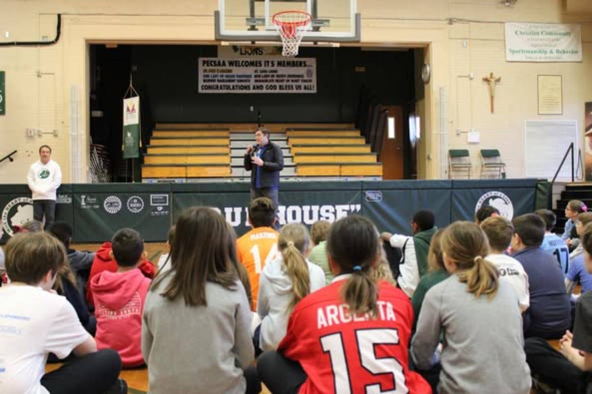 Caleb Gossett with Ronald McDonald House spoke with students at St. Leo School for Celebrate Your Community Day.