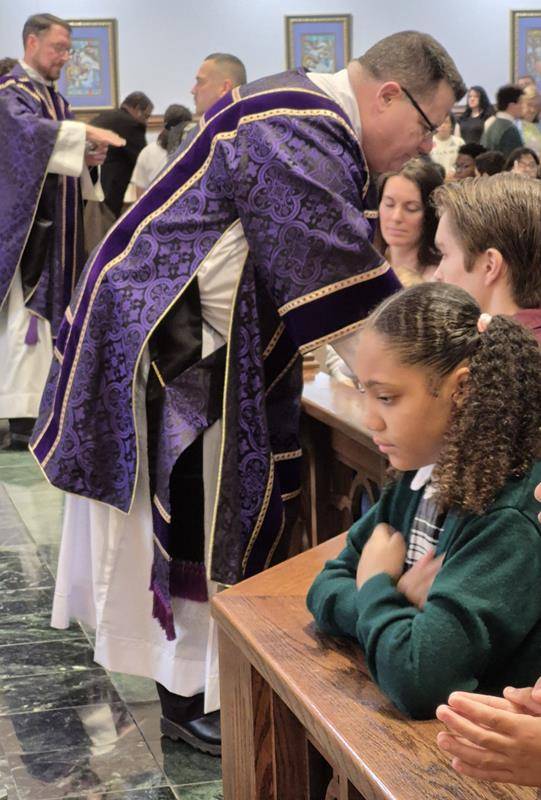 Students at St. Michael School in Gastonia receive ashes for the start of Lent. 