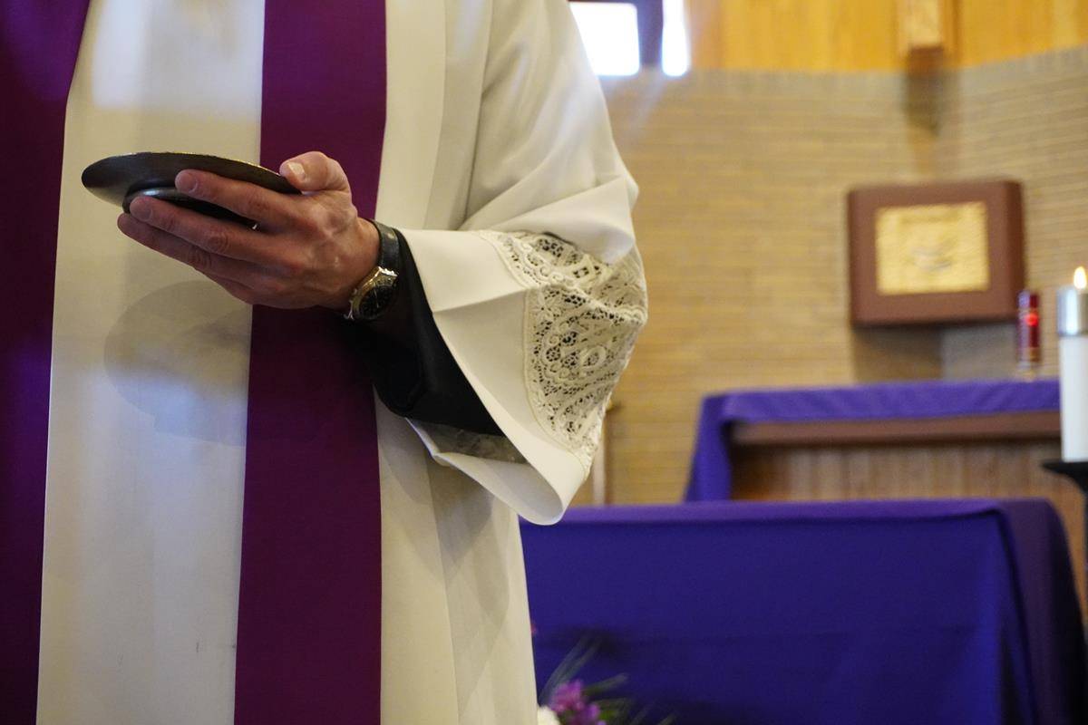 Students at Asheville Catholic School receive ashes for the start of Lent. 