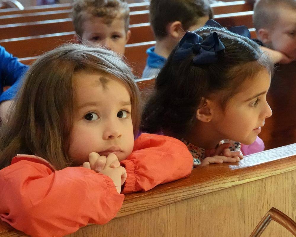 Father John Putnam celebrated a Liturgy of the Word and Ashes service for St. Mark School preschool students.