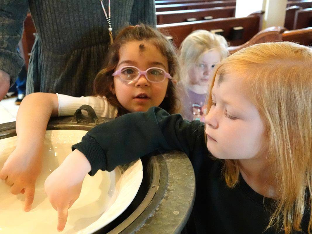 Father John Putnam celebrated a Liturgy of the Word and Ashes service for St. Mark School preschool students.