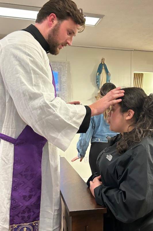 Faithful at St. Mary Margaret Church in Swannanoa attend Mass on Ash Wednesday. 
