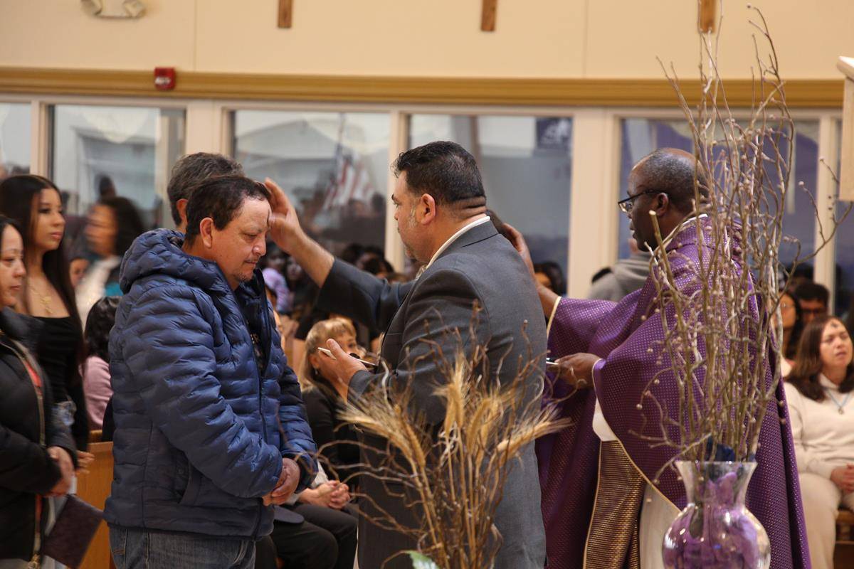 Ash Wednesday Mass at Divine Redeemer Church in Booneville. 