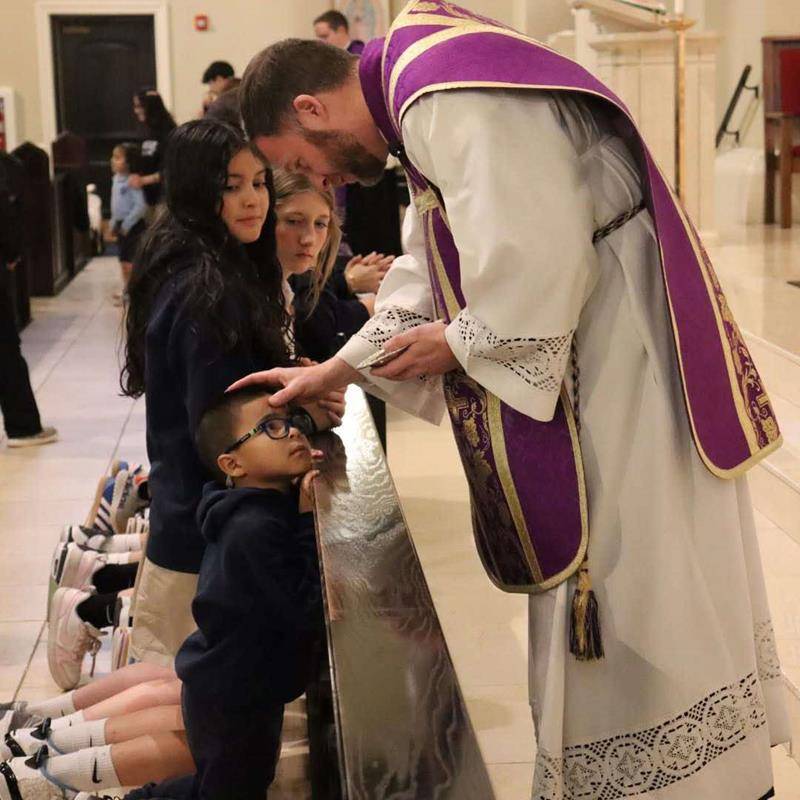 Sacred Heart School students in Salisbury receive ashes for the start of Lent. 