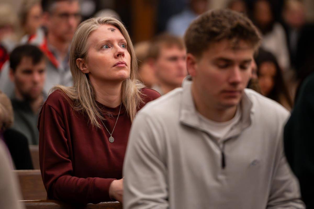 People receive ashes for the start of Lent at St. Peter Church in Charlotte. 