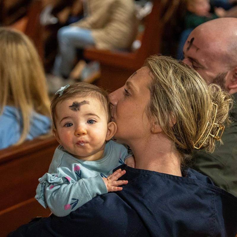 People receive ashes for the start of Lent at St. Gabriel Church in Charlotte. 