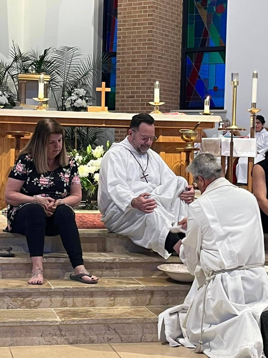 St. Therese Parish in Mooresville held a beautiful remembrance of The Lord's Last Supper. Father Mark Lawlor washes the feet of parishioners. (Photos provided)