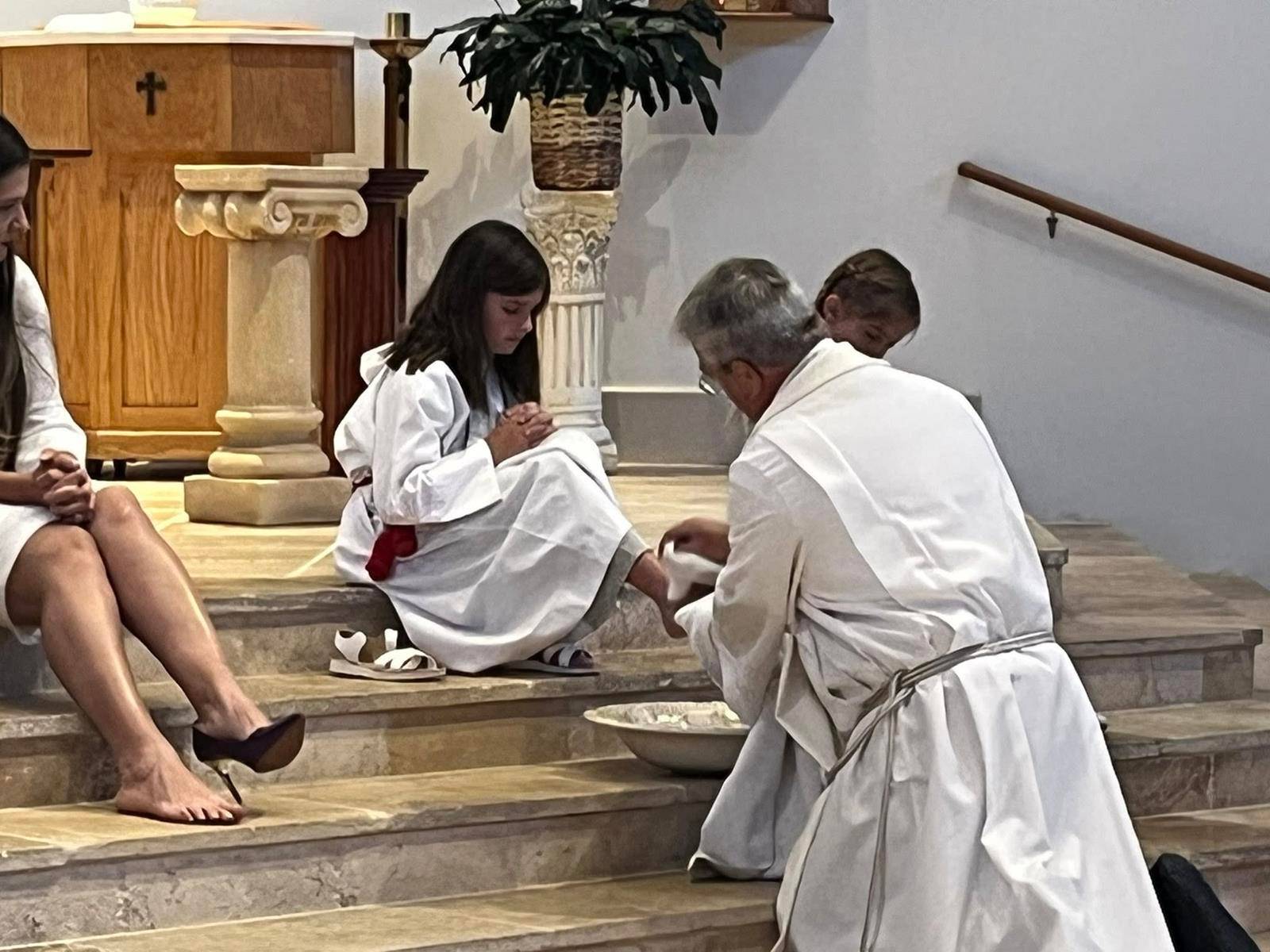 St. Therese Parish in Mooresville held a beautiful remembrance of The Lord's Last Supper. Father Mark Lawlor washes the feet of parishioners. (Photos provided)