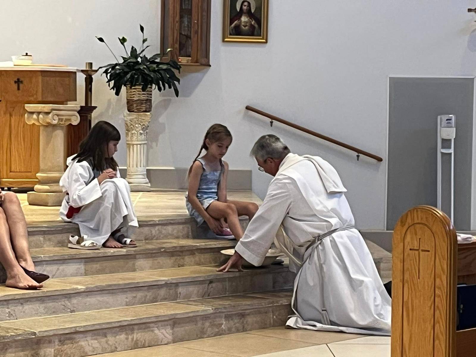 St. Therese Parish in Mooresville held a beautiful remembrance of The Lord's Last Supper. Father Mark Lawlor washes the feet of parishioners. (Photos provided)