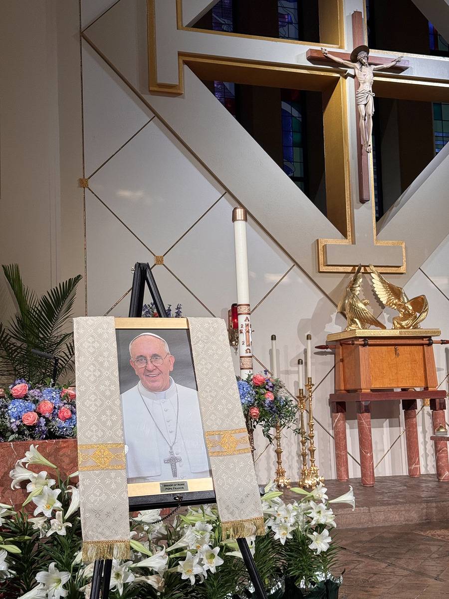 Portraits of the pope, which normally hang in the entryways of Catholic churches, were taken down a d placed near the altar. This one is from St. Gabriel Church in Charlotte. (Photo by James Johnson IV)